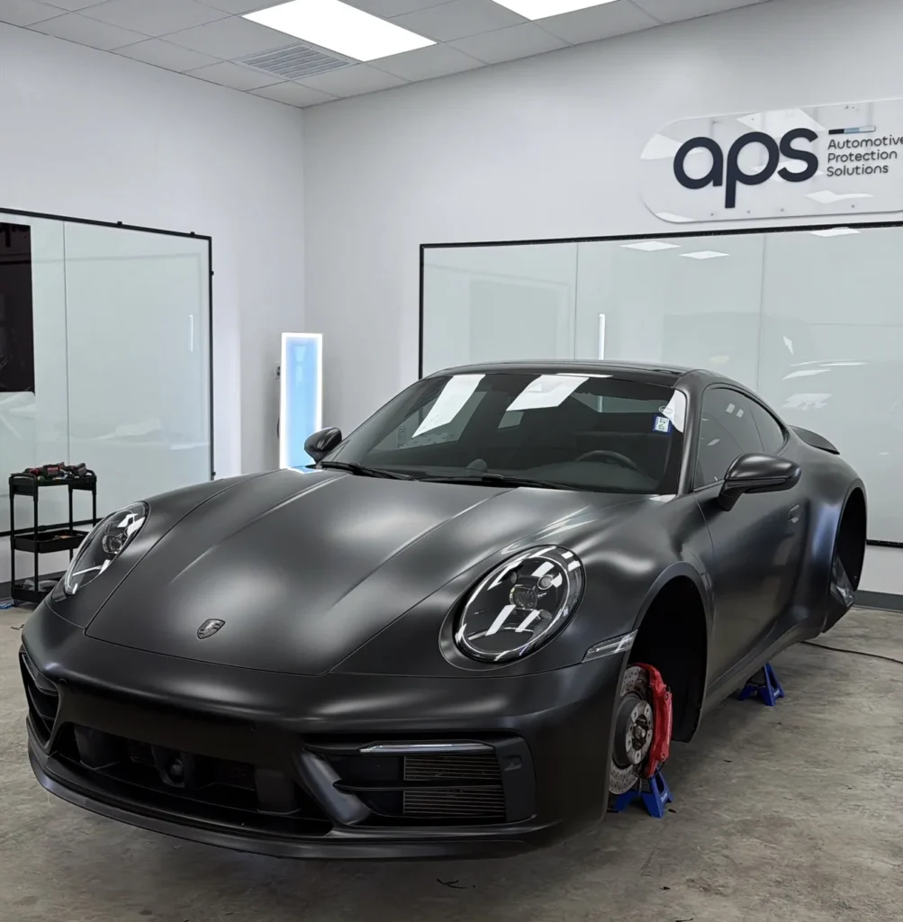 Satin black Porsche 911 in the APS Automotive Protection Solutions shop in Austin