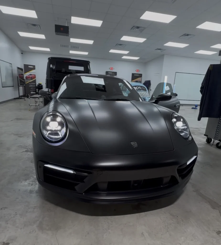 Porsche 911 after full wrap color change to XPEL Satin Midnight Black in Austin TX