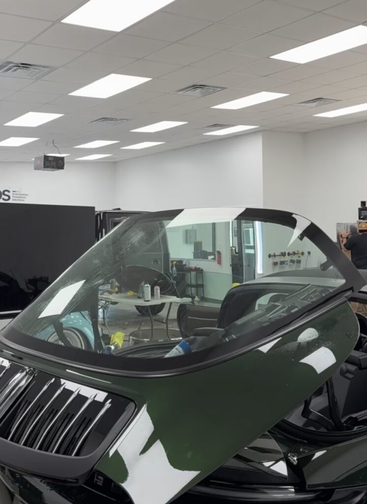 Curved rear glass of a Porsche 911 Targa 4S prepped for window tint at APS in Austin, TX