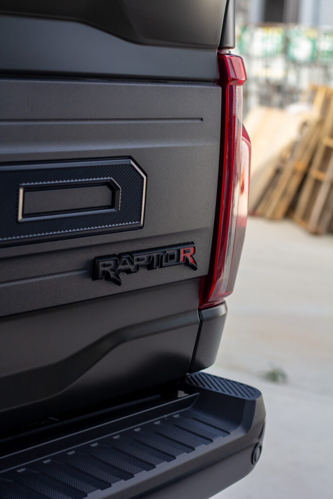 Raptor R tailgate badge with XPEL Stealth matte paint protection film