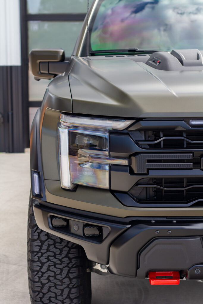 Close up headlight and hood of Ford Raptor R with XPEL Stealth matte finish
