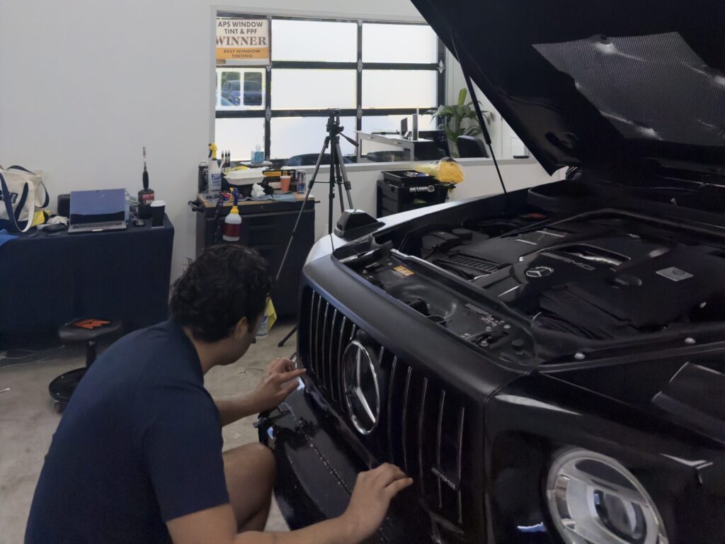 APS owner and installer working on a Mercedes-AMG G63 inside the shop in Austin, TX