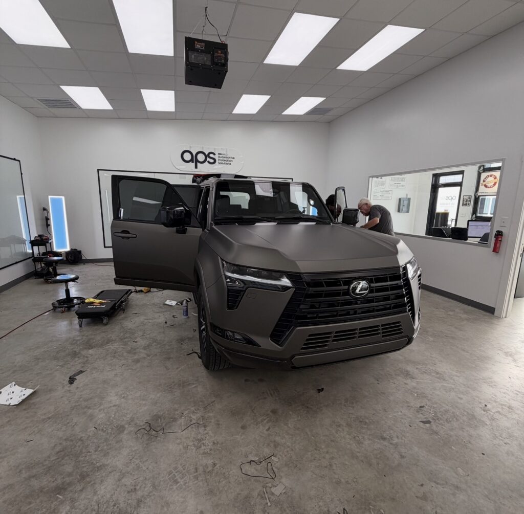 APS installers working on a Lexus SUV inside our Austin installation bay