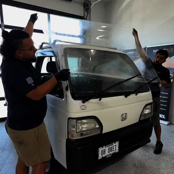 APS installers applying windshield protection film in Austin, TX