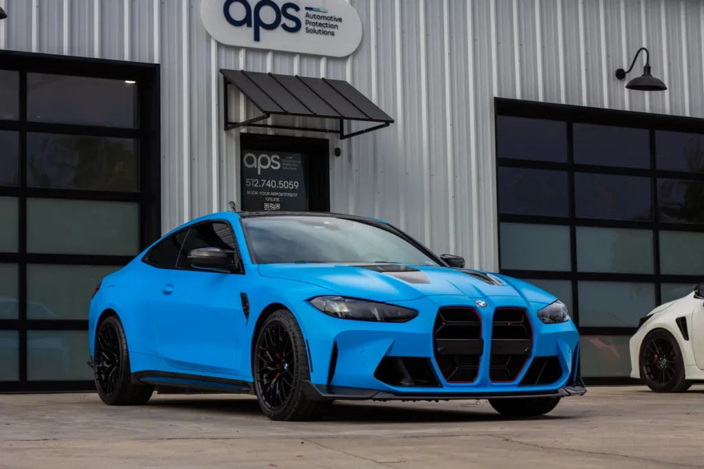 BMW M4 with blue color PPF at APS in Austin, TX