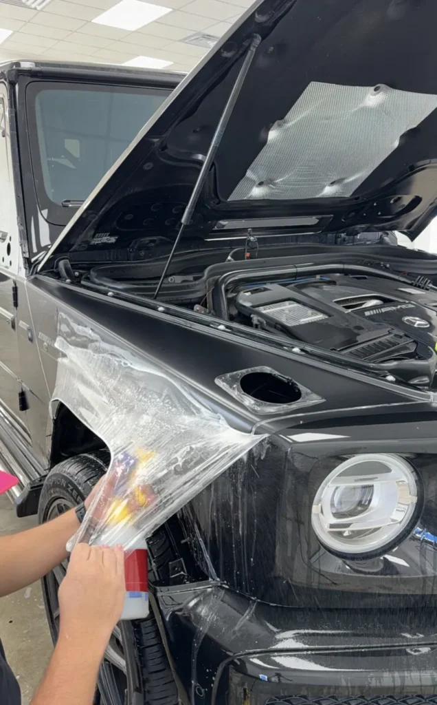 XPEL Stealth satin PPF being installed on a Mercedes G63 fender